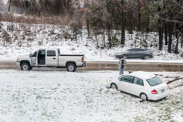 Photos: As southeastern winter storm fades, canceled flights and icy roads remain
